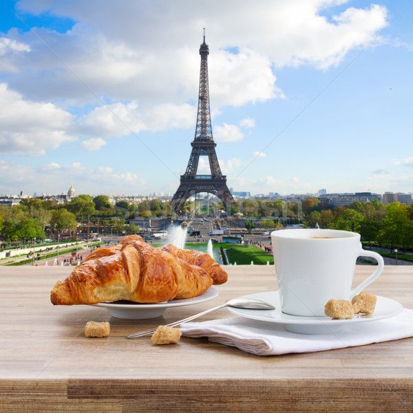 5602814 stock photo cup of coffee with croissant in paris